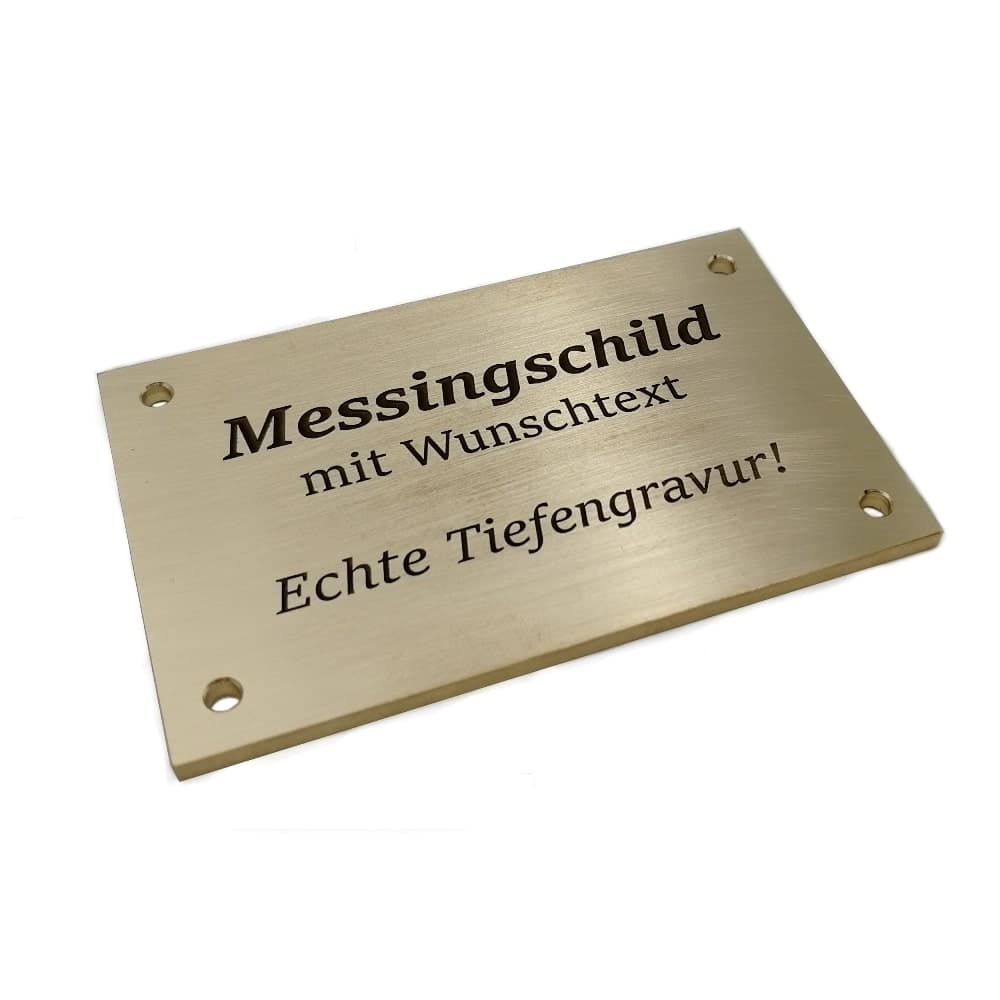 Das foto zeigt ein graviertes Türschild aus Messing.